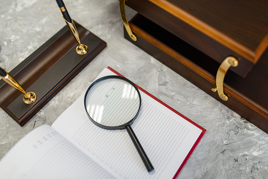 notebook-and-magnifier-on-table-stationery-store-2023-11-27-04-56-47-utc